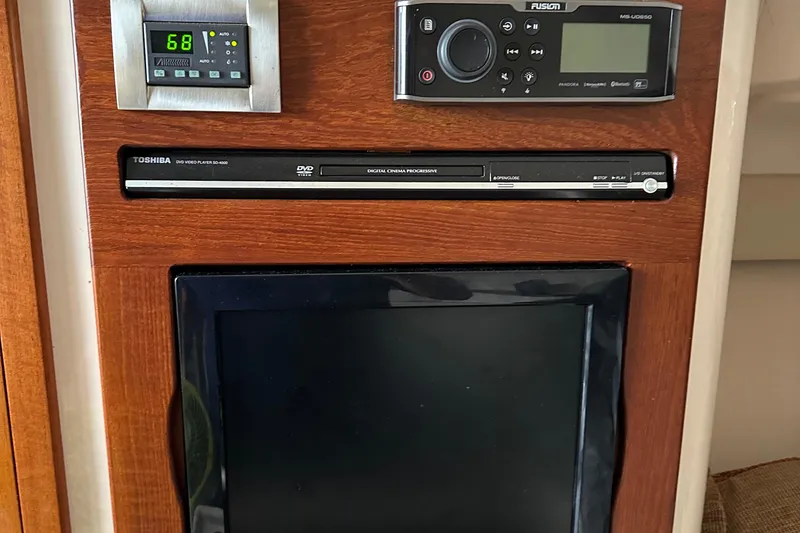 Slide: The Image of Control panel and entertainment system on 2008 Grady-White Express 330 boat. - 44