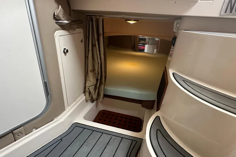 Slide: The Image of 2008 Grady-White Express 330 cabin interior with steps and storage area. - 45