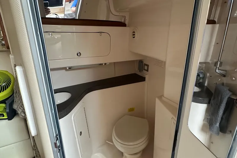 Slide: The Image of 2008 Grady-White Express 330 boat bathroom with compact design and modern amenities. - 48