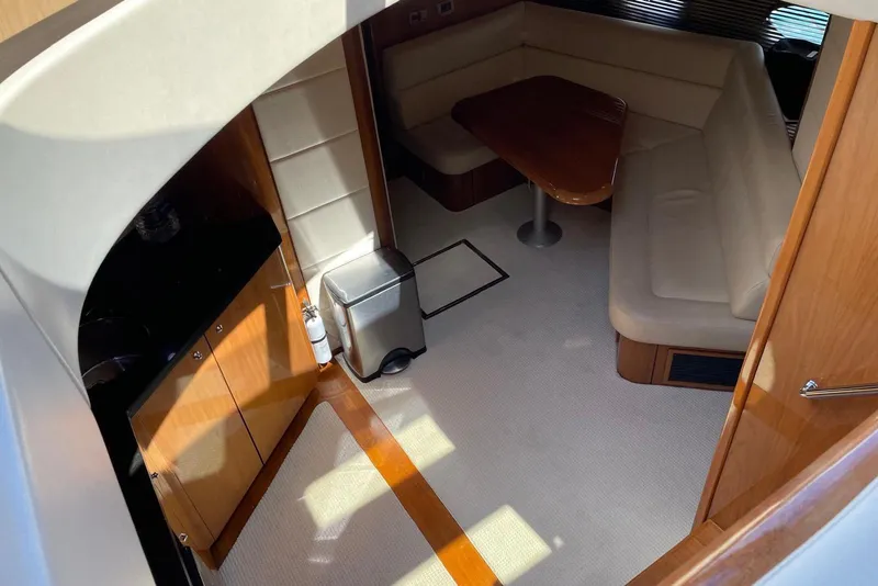 Slide: The Image of Interior of 2009 Sunseeker Predator 62 yacht with cozy seating and wooden finishes. - 22