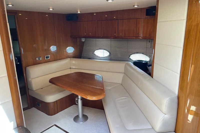 Slide: The Image of Luxurious interior of 2009 Sunseeker Predator 62 yacht with elegant seating and wooden table. - 24