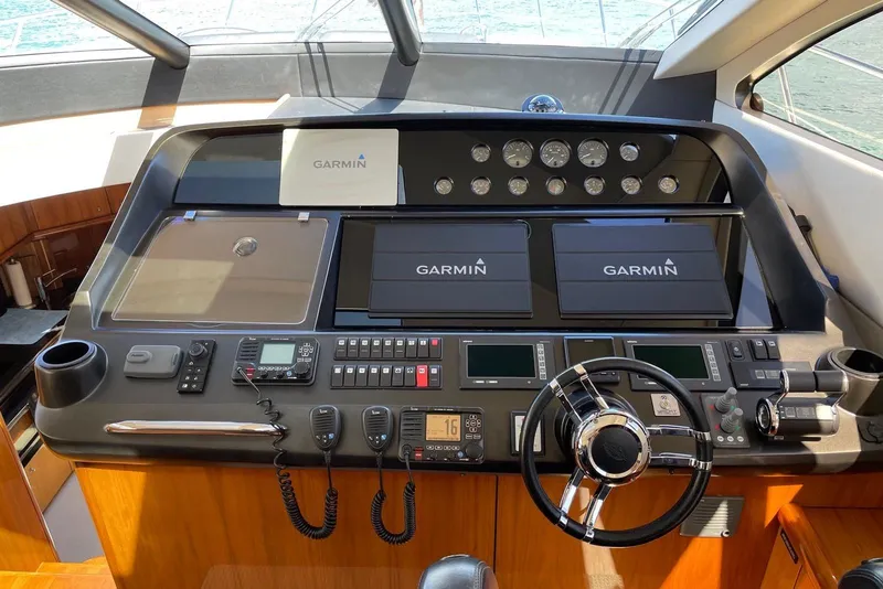 Slide: The Image of 2009 Sunseeker Predator 62 yacht helm with Garmin navigation displays and control panel. - 30