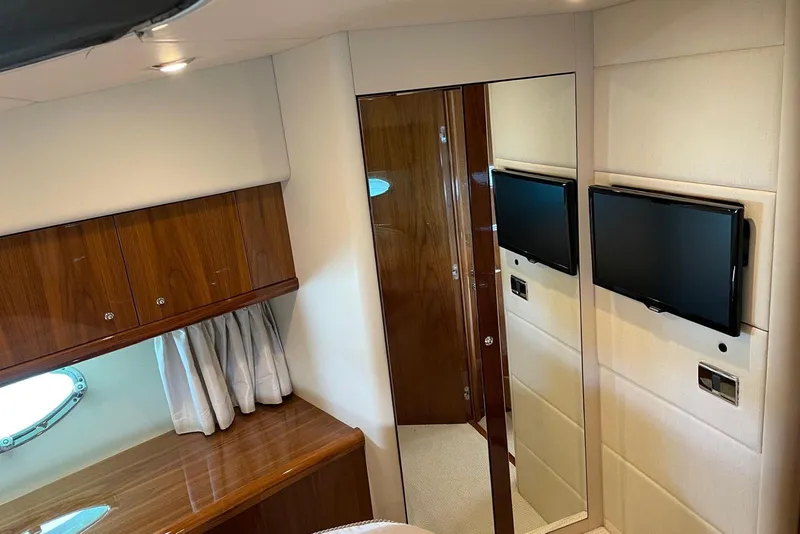 Slide: The Image of Luxurious interior of 2009 Sunseeker Predator 62 yacht with wood paneling and mounted TV. - 32