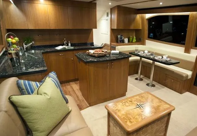 Slide: The Image of Manufacturer Provided Image: Luxurious interior of 2013 Hatteras GT54 yacht with modern kitchen and dining area. - 10