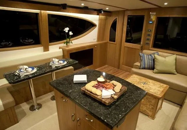 Slide: The Image of Manufacturer Provided Image: Luxurious interior of 2013 Hatteras GT54 yacht with modern kitchen and dining area. - 8