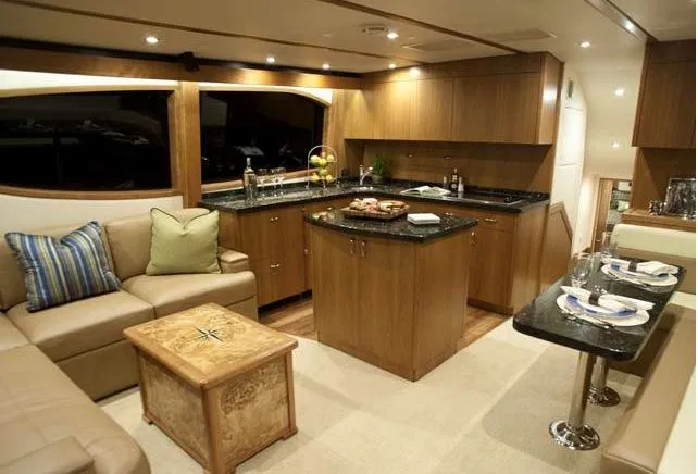 Slide: The Image of Manufacturer Provided Image: Luxurious interior of 2013 Hatteras GT54 yacht with modern kitchen and cozy seating area. - 9