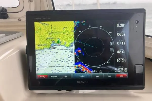 Slide: The Image of Garmin GPS display on 2014 C-Dory 22 Cruiser, showing navigation and radar data. - 13