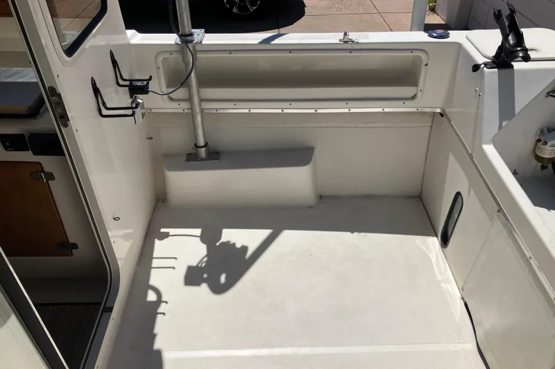Slide: The Image of 2014 C-Dory 22 Cruiser boat interior with clean, spacious deck area. - 14