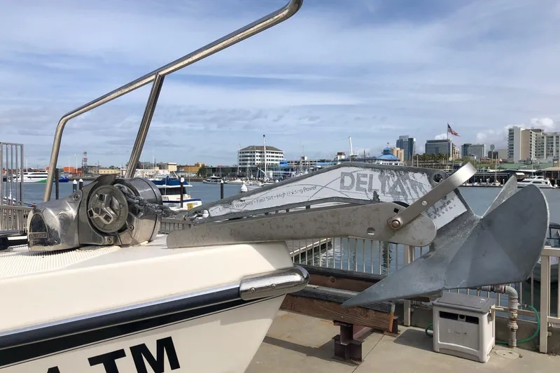 Slide: The Image of 2014 C-Dory 22 Cruiser with anchor and winch at marina dock. - 15