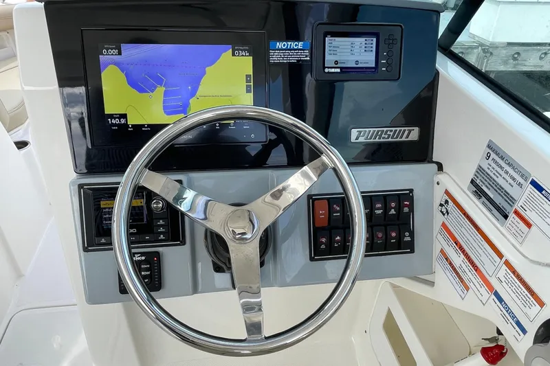 Slide: The Image of Steering console of 2020 Pursuit DC 235 Dual Console with navigation display. - 17