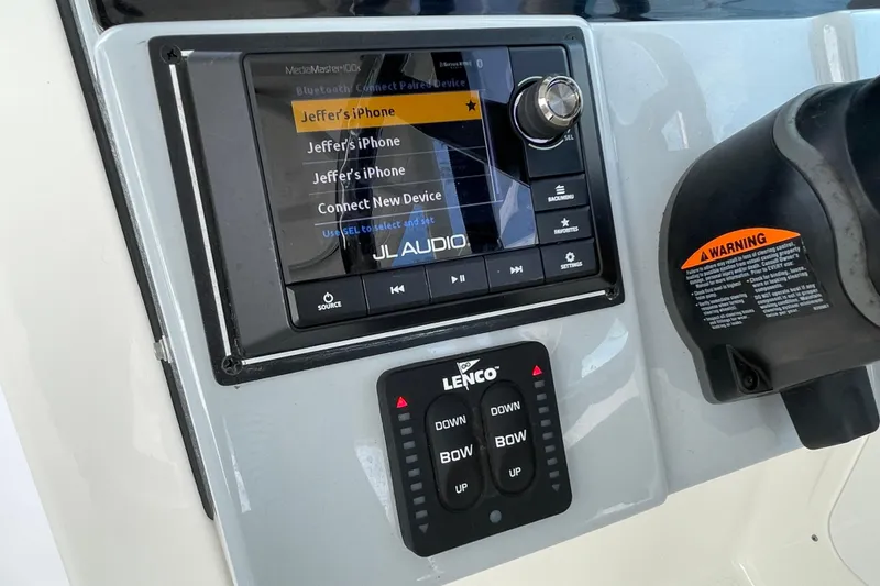 Slide: The Image of Control panel of 2020 Pursuit DC 235 Dual Console with JL Audio system and Lenco controls. - 20