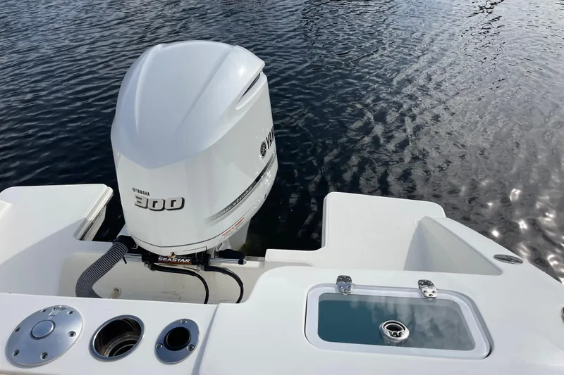 Slide: The Image of 2020 Pursuit DC 235 Dual Console with Yamaha 300 engine on calm water. - 34