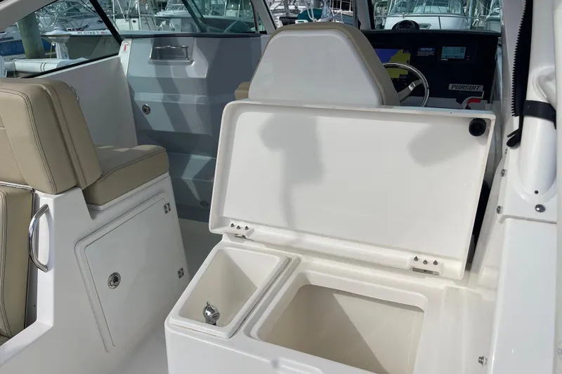 Slide: The Image of 2020 Pursuit DC 235 Dual Console interior with open storage and seating. - 36