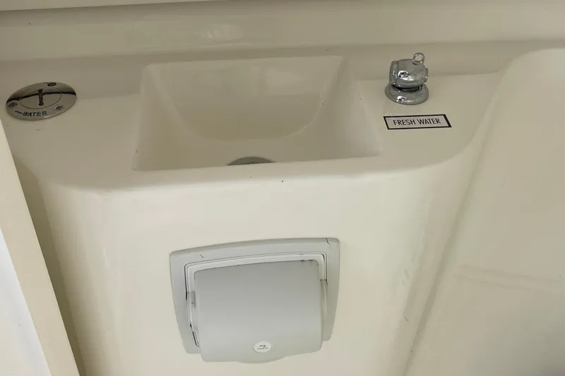 Slide: The Image of Freshwater sink on 2020 Pursuit DC 235 Dual Console boat. - 42