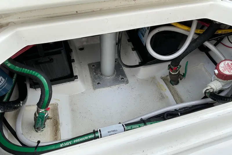 Slide: The Image of 2020 Pursuit DC 235 Dual Console boat interior wiring and components. - 52