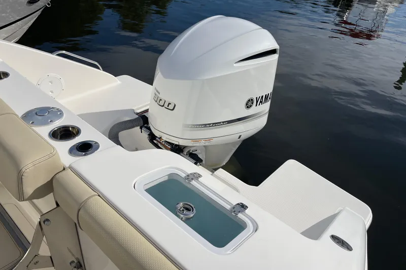 Slide: The Image of 2020 Pursuit DC 235 Dual Console boat with Yamaha outboard motor on calm water. - 57
