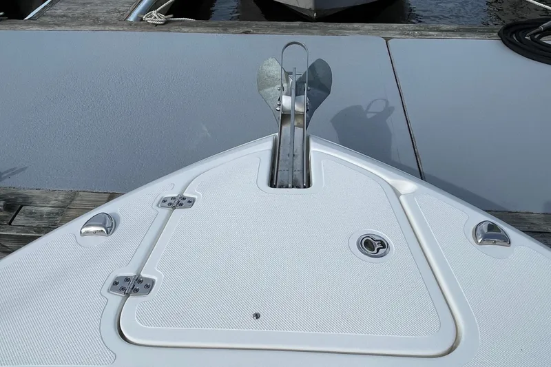 Slide: The Image of Bow of 2020 Pursuit DC 235 Dual Console boat with anchor and deck details. - 63
