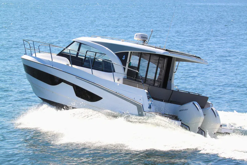Slide: The Image of 2022 Beneteau Antares 11 cruising on open water, showcasing sleek design and powerful engines. - 1