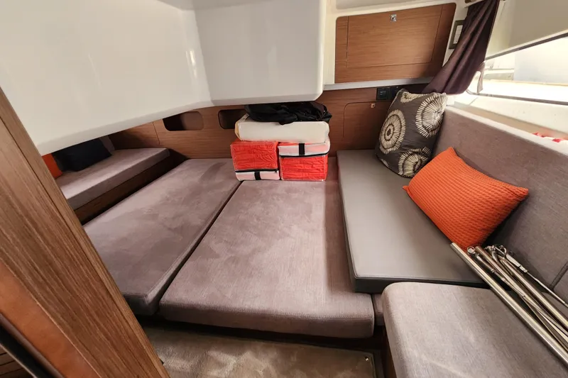 Slide: The Image of Interior of 2022 Beneteau Antares 11 with cozy seating and cushions. - 20