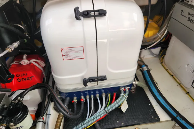 Slide: The Image of Engine compartment of 2022 Beneteau Antares 11 with generator and wiring. - 36