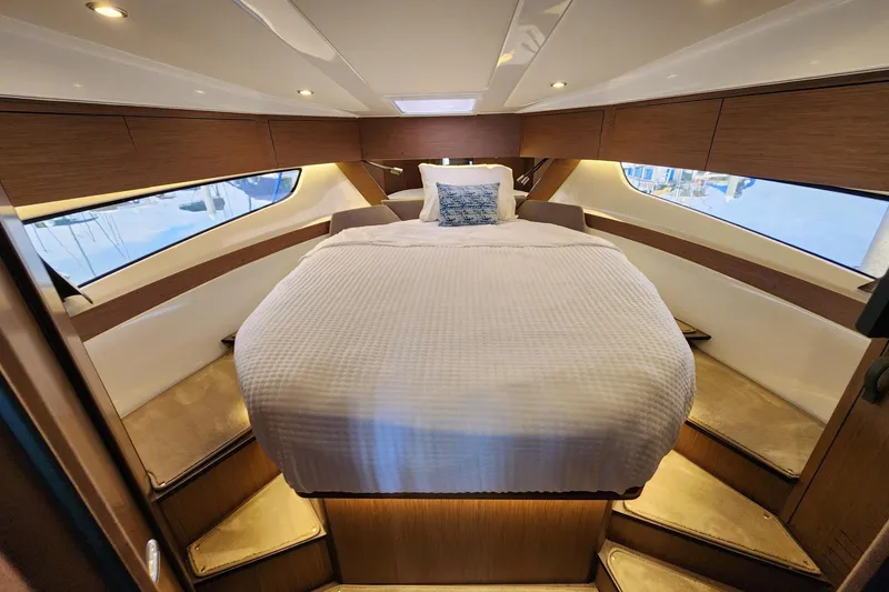 Slide: The Image of Luxurious cabin interior of 2022 Beneteau Antares 11 with cozy bed and ambient lighting. - 44