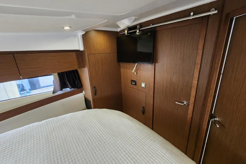 Slide: The Image of Luxurious cabin interior of 2022 Beneteau Antares 11 with wood finish and modern amenities. - 46