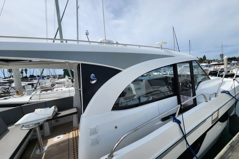 Slide: The Image of 2022 Beneteau Antares 11 yacht docked at marina, showcasing sleek design and modern features. - 7
