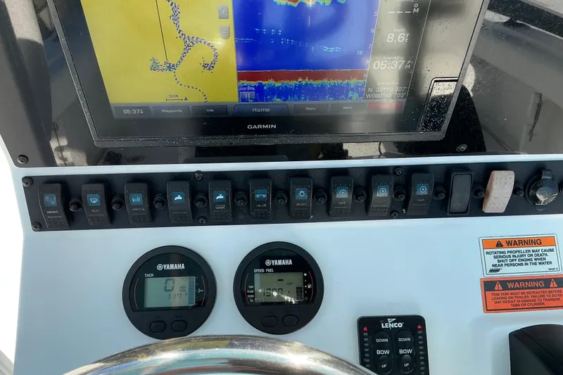 Slide: The Image of Control panel of a 2019 Sea Hunt Ultra 225 boat with Garmin display and Yamaha gauges. - 15