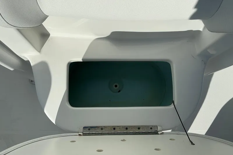 Slide: The Image of 2019 Sea Hunt Ultra 225 boat storage compartment, open and empty. - 22