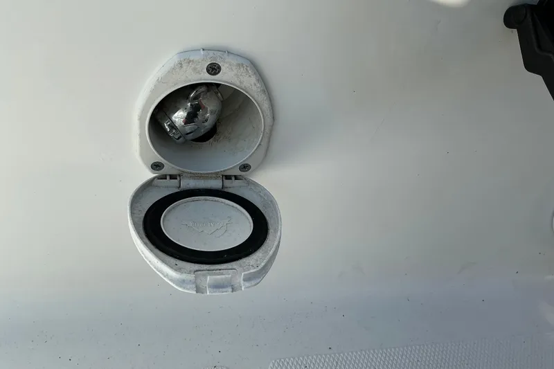 Slide: The Image of Open fuel cap on a 2019 Sea Hunt Ultra 225 boat. - 23