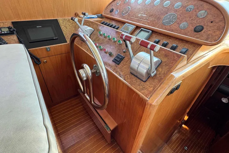 Slide: The Image of Horizon E56 yacht under maintenance, showcasing propeller and hull details, year 2000 model. - 16