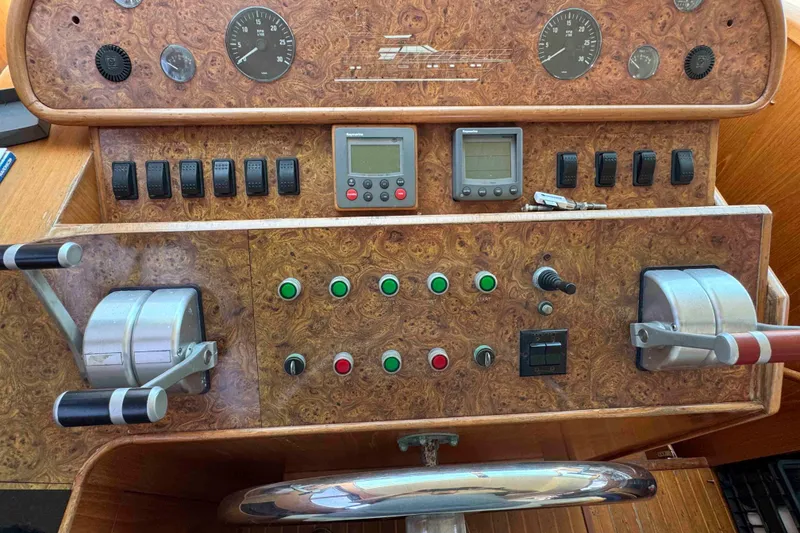 Slide: The Image of Horizon E56 yacht in harbor, 2000 model, overlooking boats and hills. - 18