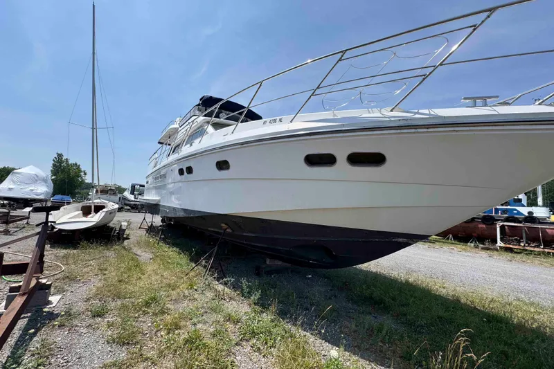 Slide: The Image of 2000 Horizon E56 yacht on dry dock under clear blue sky. - 3