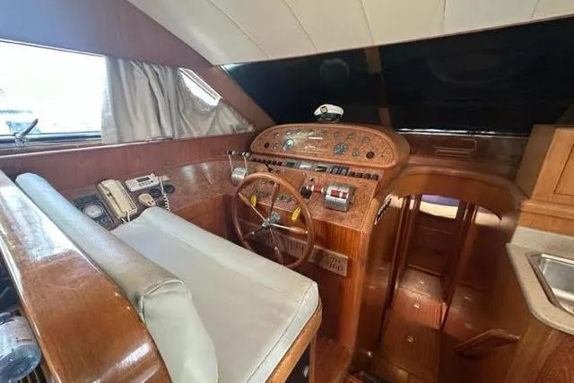 Slide: The Image of Interior of a 2000 Horizon E56 yacht cockpit with wooden dashboard and steering wheel. - 32