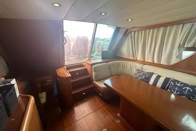Slide: The Image of Interior of a 2000 Horizon E56 yacht with wooden furnishings and upholstery. - 42