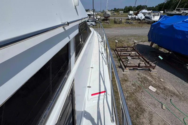 Slide: The Image of Luxury yacht "Magic Moments" by Horizon E56, 2000 model, with sleek design and upper deck. - 9