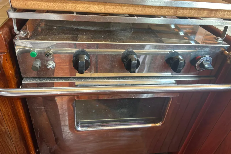 Slide: The Image of Stainless steel oven with control knobs on a 1980 Hans Christian 43 yacht. - 13