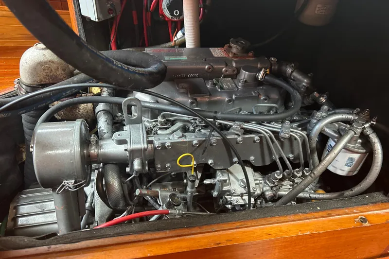 Slide: The Image of Engine of a 1980 Hans Christian 43 sailboat, showcasing detailed mechanical components. - 24