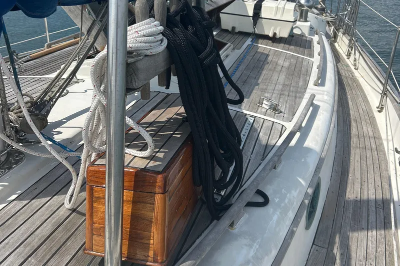 Slide: The Image of Deck of 1980 Hans Christian 43 sailboat with ropes and wooden storage box. - 48