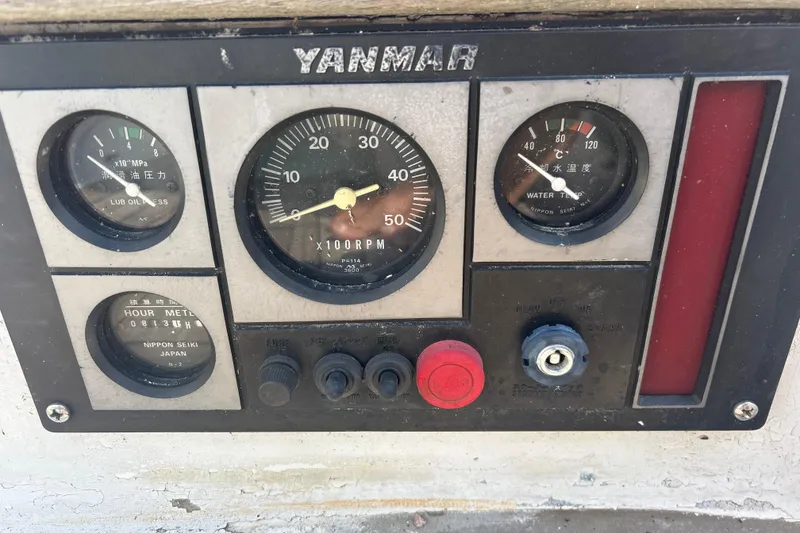 Slide: The Image of Control panel of a 1980 Hans Christian 43 sailboat with Yanmar engine gauges. - 51