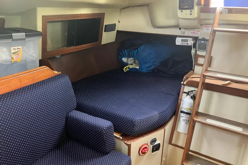 Slide: The Image of Interior of 1983 Pearson 303 Sloop with polka dot upholstery and storage. - 4