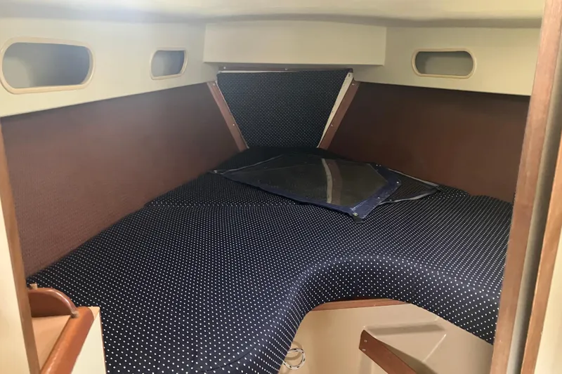 Slide: The Image of Interior cabin of 1983 Pearson 303 Sloop with polka dot bedding. - 5