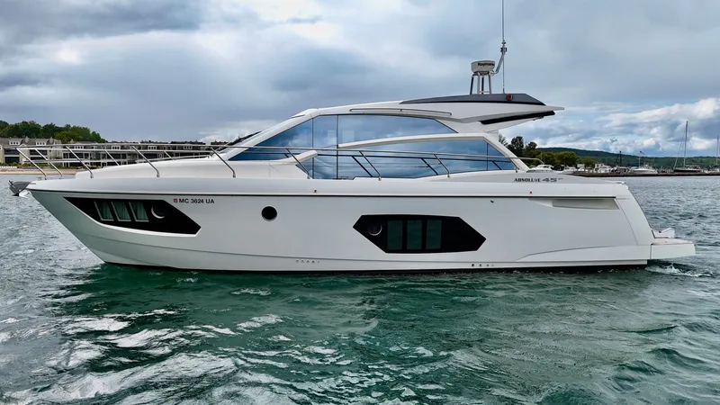 Slide: The Image of 2016 Absolute Sport Yacht on water, sleek design, overcast sky background. - 10