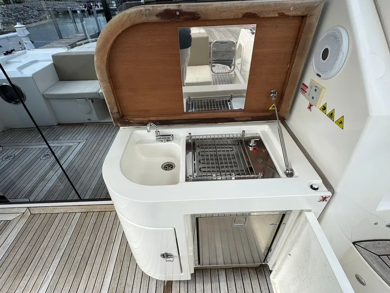 Slide: The Image of Outdoor kitchenette on 2016 Absolute Sport Yacht with sink, grill, and storage. - 29