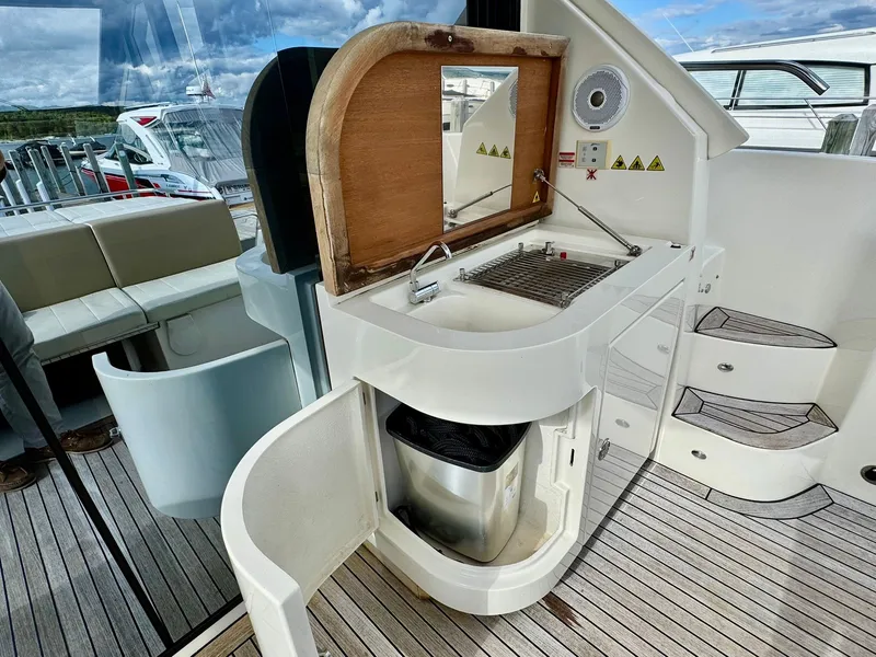 Slide: The Image of Outdoor kitchenette on a 2016 Absolute Sport Yacht with grill and sink. - 30