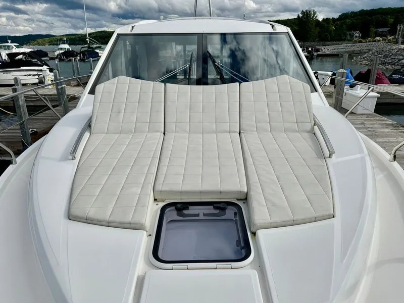 Slide: The Image of Luxurious 2016 Absolute Sport Yacht with cushioned sunbathing area, docked at marina. - 36