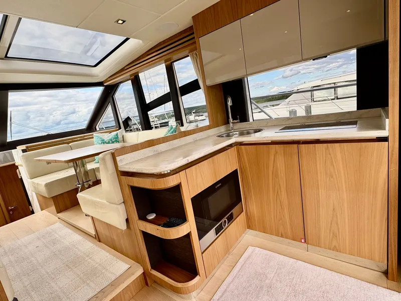 Slide: The Image of Luxurious interior of a 2016 Absolute Sport Yacht with modern kitchen and seating area. - 39
