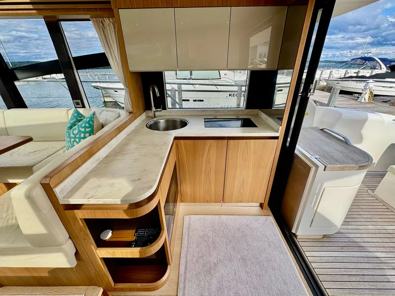 Slide: The Image of Luxurious 2016 Absolute Sport Yacht interior with modern kitchen and scenic marina view. - 40