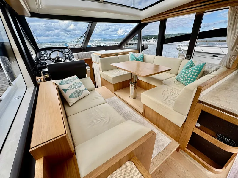 Slide: The Image of Luxurious interior of a 2016 Absolute Sport Yacht with plush seating and scenic views. - 43