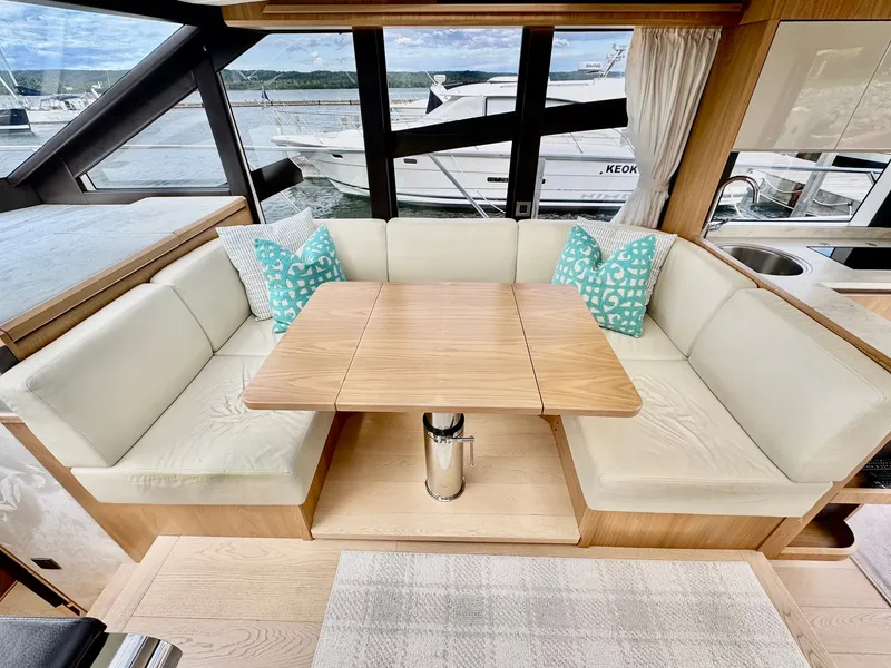 Slide: The Image of Luxurious 2016 Absolute Sport Yacht interior with elegant seating and wooden table. - 44